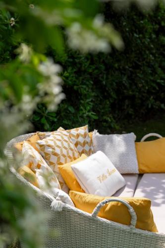 a picnic basket with cushions on a table at Villa Arizona in Milano Marittima