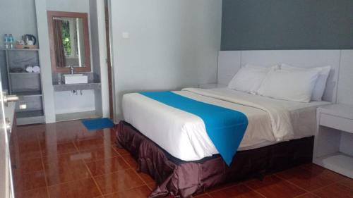 Кровать или кровати в номере Hotel Cavery Beach