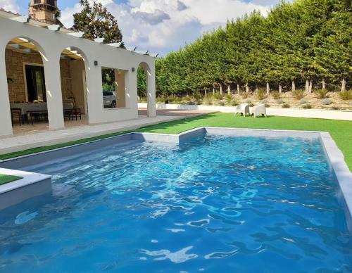 a swimming pool in the yard of a house at Villa With Double Kitchen And Pool In Umbria in Stroncone