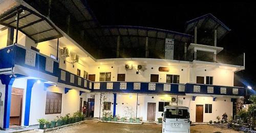 a building with a car parked in front of it at kk house in Kataragama