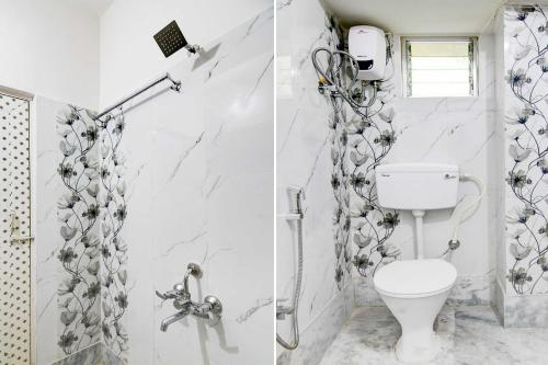 a white bathroom with a toilet and a shower at Collection O Hiland Park in Kolkata