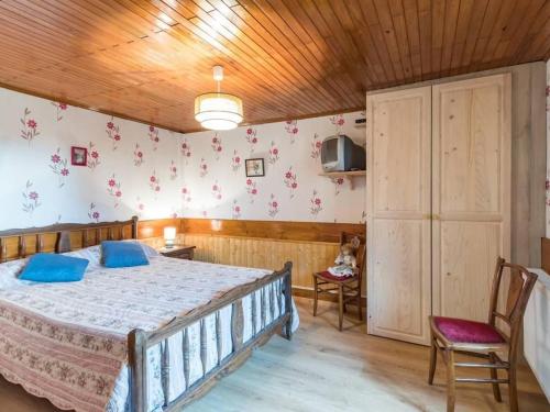 a bedroom with a bed and a wooden ceiling at Gîte dans un hameau - FR-1-583-483 in Saint-Bresson