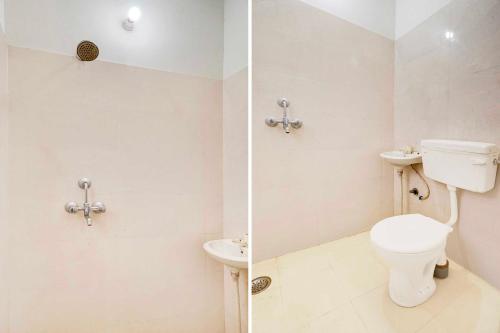 a bathroom with a toilet and a sink at Collection O Jagatpura Near JTM Mall in Jaipur