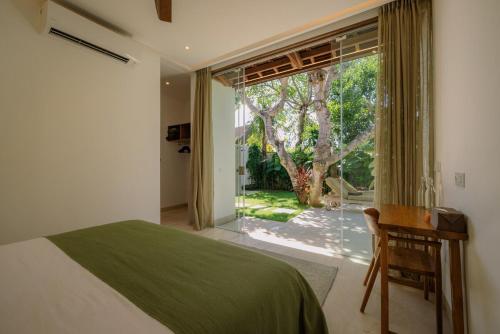 Postel nebo postele na pokoji v ubytování Toscana Luxury Villa, Uluwatu