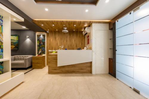 a bathroom with a large white tub and a sink at RR Residency in New Delhi