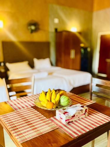 a bowl of bananas on a table in a hotel room at Olu Vila Private Cabana in Mabodale