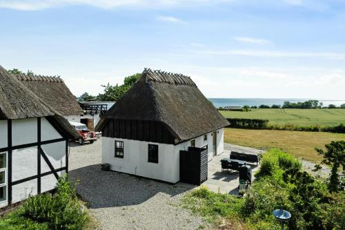 an aerial view of a house with a roof at Enjoy Nature In A Thatched Annex From 1860 in Frørup
