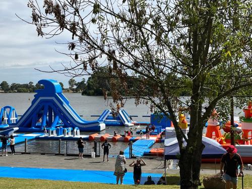 a group of people playing in a water park at Lakeside Retreat Nagambie in Nagambie