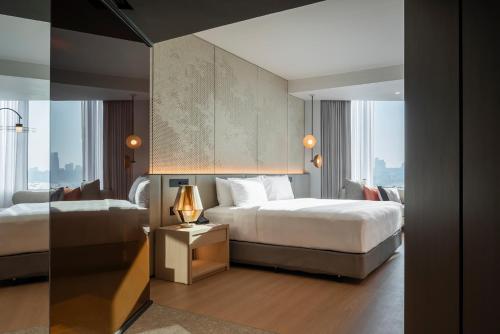 Кровать или кровати в номере Hard Rock Hotel Pattaya
