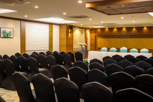 a conference room with black chairs and a table at HOTEL OCEAN VISTA BAY in Visakhapatnam