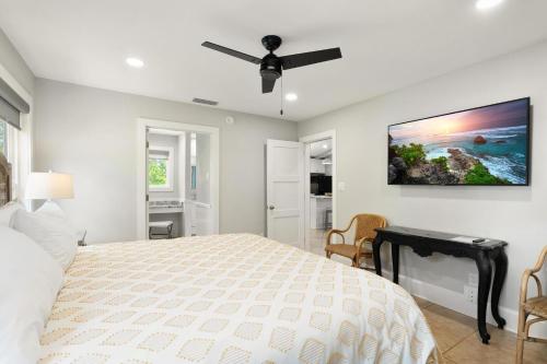 a bedroom with a bed and a ceiling fan at About Time-Private Pool-Newly Remodeled in St. George Island