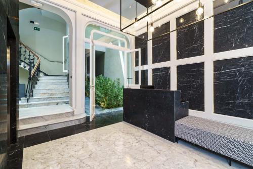 a hallway of a home with a bench and stairs at The Valentia Cabillers in Valencia