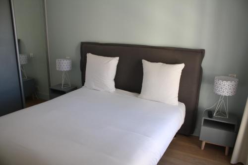 Ένα ή περισσότερα κρεβάτια σε δωμάτιο στο Florella Antibes Apartment