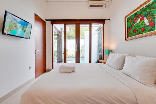 Ένα ή περισσότερα κρεβάτια σε δωμάτιο στο Villa Ganesha 2BR with Private Pool - Canggu