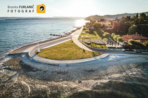 an aerial view of the water and a road at B&B Isola in Izola