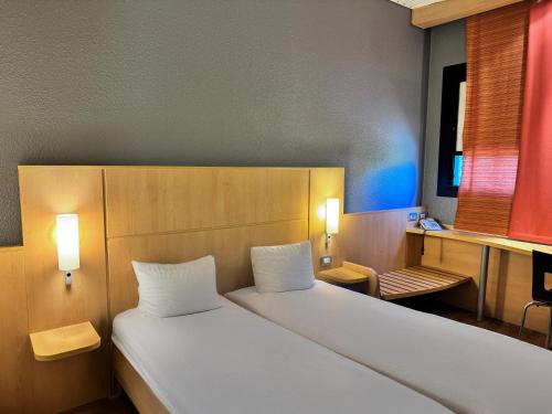 A bed or beds in a room at a&o Hostel Milano Ca Granda