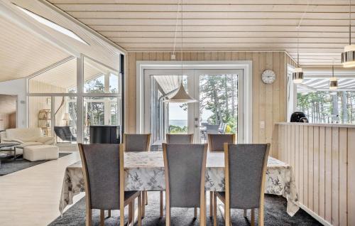 a dining room with a table and chairs at Amazing Home In Kalundborg With Wifi in Kalundborg