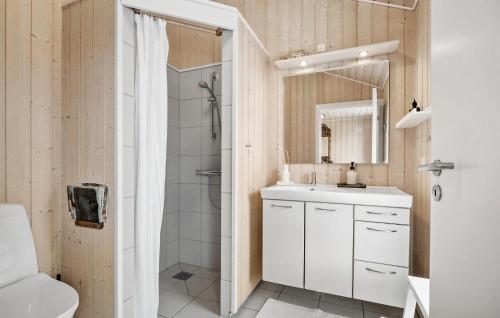 a white bathroom with a shower and a sink at Amazing Home In Kalundborg With Wifi in Kalundborg