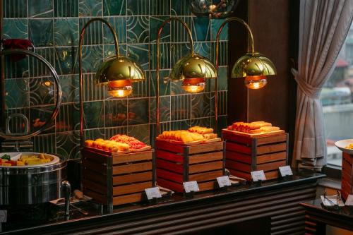 a display of food in a restaurant with lights at HOTEL de LAGOM in Hanoi