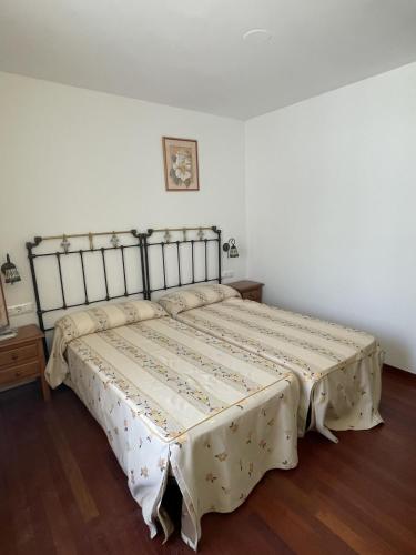a bedroom with a large bed in a room at Hostal rural en el Cañón del Río Lobos in Ucero