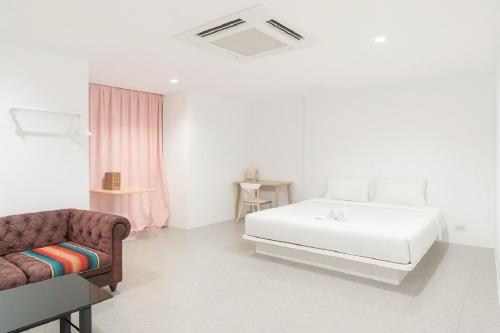 En eller flere senge i et værelse på Mitr INN Sukhumvit 2 - BTS Nana มิตร อินน์ สุขุมวิทซอย 2 บีทีเอส นานา