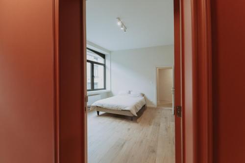 Ένα ή περισσότερα κρεβάτια σε δωμάτιο στο Biloba CoLiving House