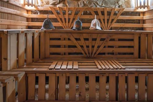 a sauna with two birds sitting on top of it at Котеджі "У Яни" in Yablunytsya