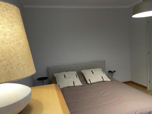 a bedroom with a bed with two pillows at Volcanic Mieres Retreat in Mieres