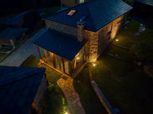 an overhead view of a house with a blue roof at Complejo Rural Lar de Vies in A Pontenova