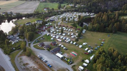 an aerial view of a parking lot with cars at Sanda Camping og Hytteutleie in Øvrebø