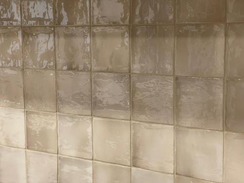 a tiled wall in a bathroom with at Volcanic Mieres Retreat in Mieres