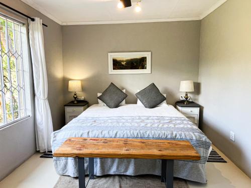 Ein Bett oder Betten in einem Zimmer der Unterkunft 24 Degrees South Country Estate