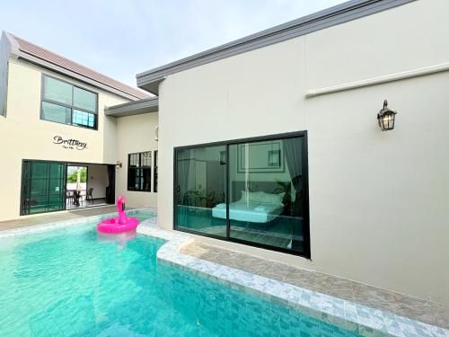 a swimming pool in the backyard of a house at Brittany Private Pool Villa-Pattaya in Na Jomtien