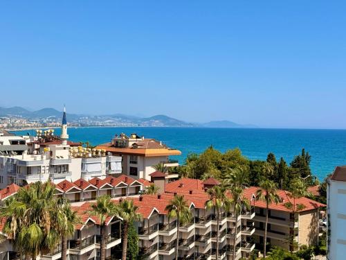 a view of a city with the ocean in the background at SA Apartments! Sea View 2BD Flat in Alanya