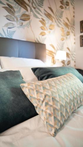 a bedroom with a bed with a pillow on it at SNÖ Pazo de Adrán in Milladoiro
