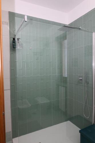 a shower with a glass door in a bathroom at B&B Da Fifi in Castel San Giorgio