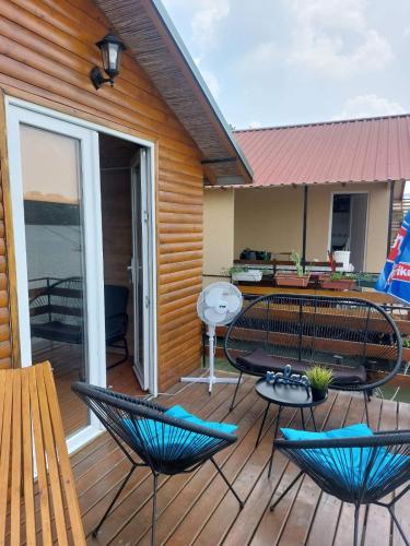 a patio with chairs and tables on a deck at Splav na Savi in Pe°ani