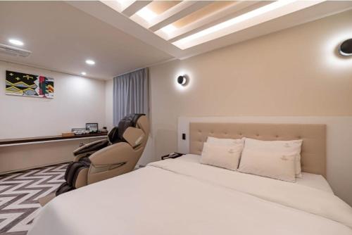 Letto o letti in una camera di Yangsan Cadeo Hotel