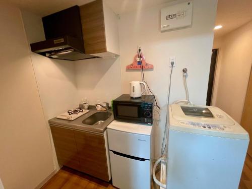 Η κουζίνα ή μικρή κουζίνα στο Uhome Kamiitabashi Apartment