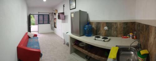 a kitchen with a counter and a sink in a room at Depto Zona UV Lagos Isleta 102 in Xalapa