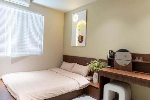 Ένα ή περισσότερα κρεβάτια σε δωμάτιο στο Thang Homestay - Vinhome Ocean Park 3, Van Giang, Hung Yen