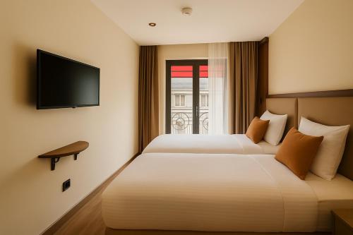 Postel nebo postele na pokoji v ubytování Mandala Karaköy Hotel
