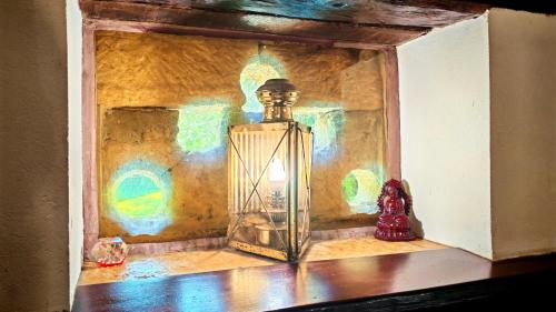 a glass lantern sitting on a table in a room at Bonfarto Locations in Urval