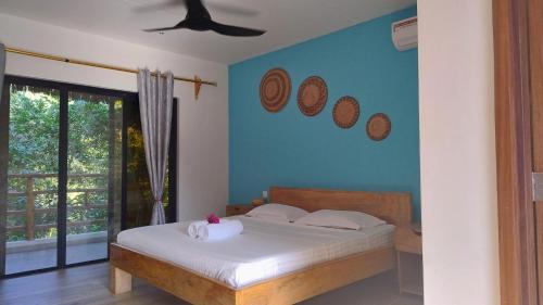 Giường trong phòng chung tại Bush Paradise Kiwengwa