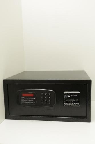 a microwave oven with a digital clock on a counter at Moment Boutique Apartments in Belgrade