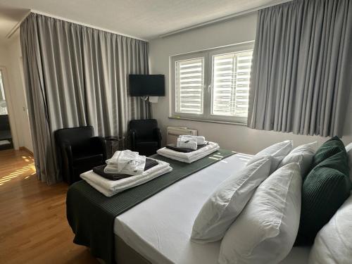 Postel nebo postele na pokoji v ubytování Villa INAMI