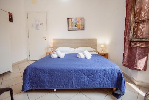 Posteľ alebo postele v izbe v ubytovaní B&B Toscana