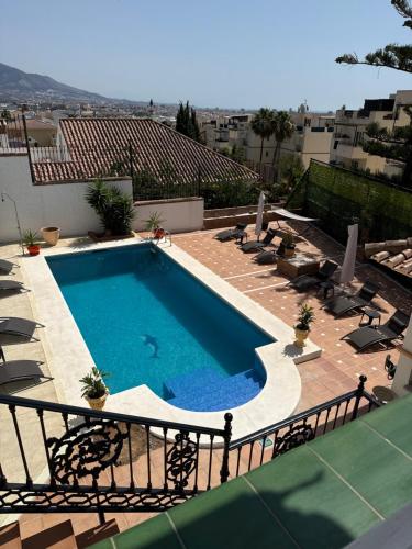 a swimming pool on top of a building at Amaca in Mijas Costa