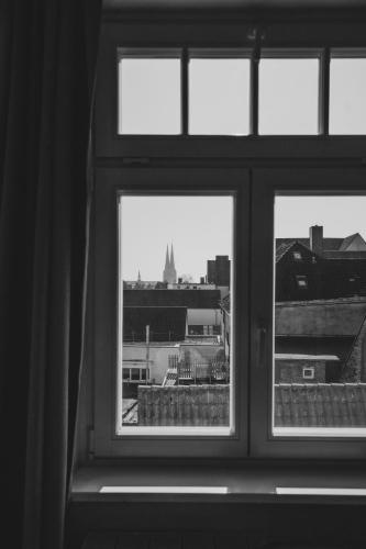 a window with a view of a city skyline at Apartment Josephine in Lübeck