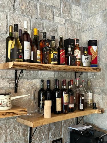 a shelf filled with lots of bottles of wine at Gorska Dolina in Ivanova Korita
